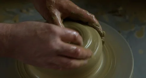 Close up shot of potters hand starting to produce a clay jug. Stock Footage 101289102