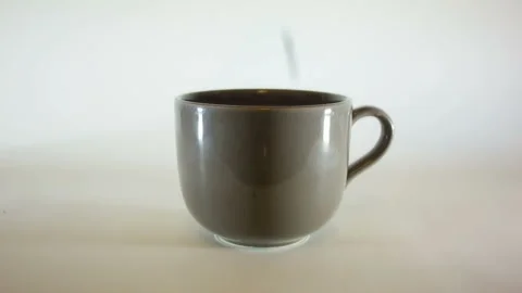 Close Up Shot of Pouring Coffee Beans In Coffee Mug Stock Footage 234830177