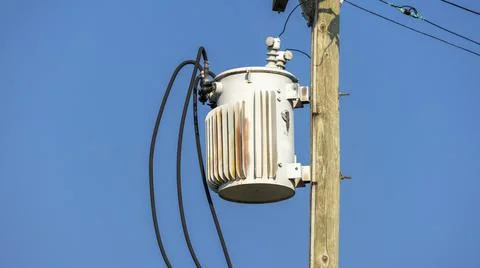 Close up shot of Power transformer on the electrical pole Stock Photos