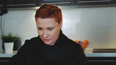 Close-up shot of pretty bakery worker decorating sweet cookies with special food Stock Footage 131530271