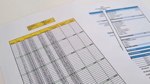 Close up shot of a print outs of excel table of a bank loan amortization tabl Stock Footage 210505014
