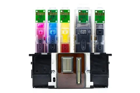 A close-up shot of a printer head and ink cartridges inserted into it, isolat Stock Photos