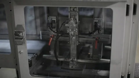 Close shot of a printing machine functioning on a factory. 動画素材 134330532