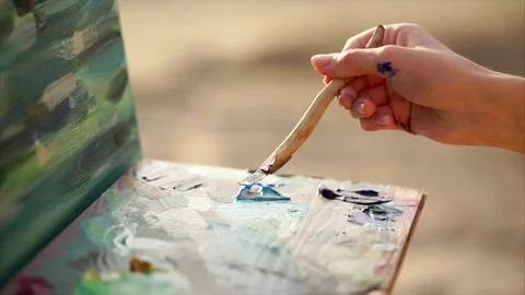 Close up shot of the process of mixing oil paint with palette knife Stock Footage 76389258