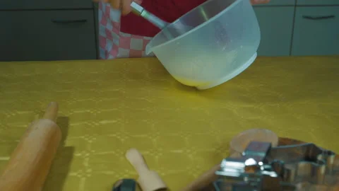 Close-up shot of  process of preparing and whipping homemade pastries. Video stock 169452343