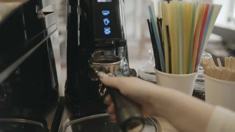 Close-up shot of a professional coffee machine on a counter in a cafe and a Vídeo Stock 153087077