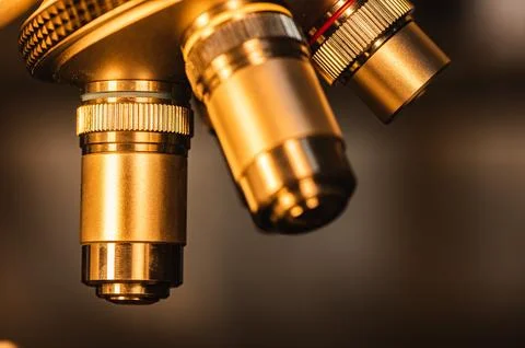 Close-up shot of professional scientific microscope with metal lens setting.. Фото