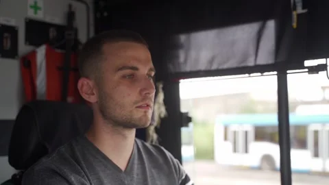 Close up shot of professional transport operator focused on driving trolleybus Stock Footage 256994898