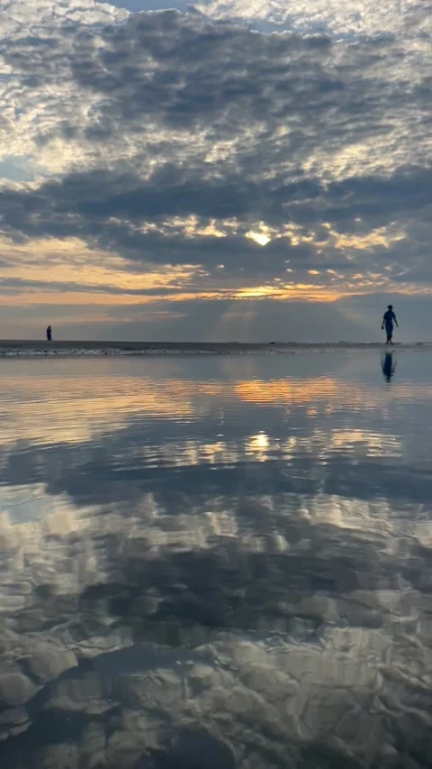 Close up shot of puddle at beach in sand during sunrise 스톡 동영상 196928217