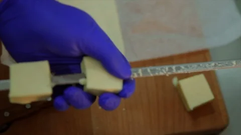 Close up shot of putting three pieces of cheese on skewer 스톡 동영상 104057082