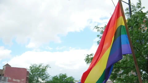 Close up Shot of rainbow Flag at pride parade. Slow motion. Chicago IL. Stock Footage 248336040