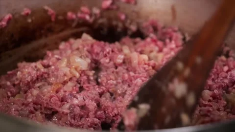 Close Up Shot Of Raw Minced Beef Being Placed Into Hot Pan Stock Footage 331634312