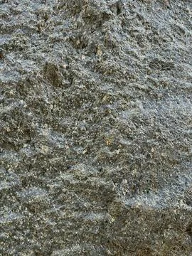 Close-up shot of raw rough stone surface Stock Photos