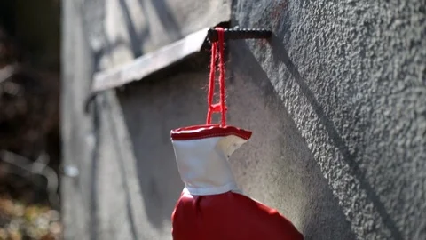 Close-up shot on red boxing gloves hanging on a rough concrete wall 스톡 동영상 105649558