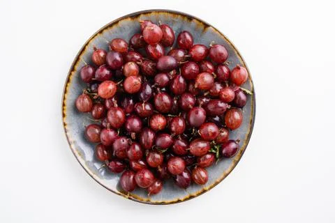 Close up shot of red gooseberry harvest. Healthy lifestyle and eating. Vegan Stock Photos