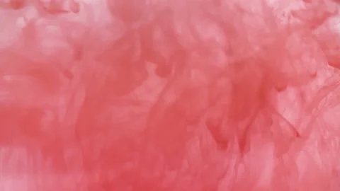 Close-up shot. Red gouache clouds in water and move in slow motion. Use for inky Stock Footage 236577160