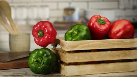 Close up shot of red pepper falling from a basket in slow motion Stock Footage 152904073