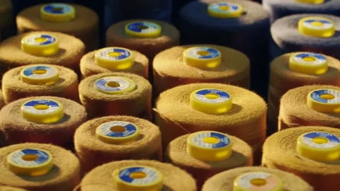 Close-up shot of reel of thread. reels lined up side by side. Stock Footage 138820801
