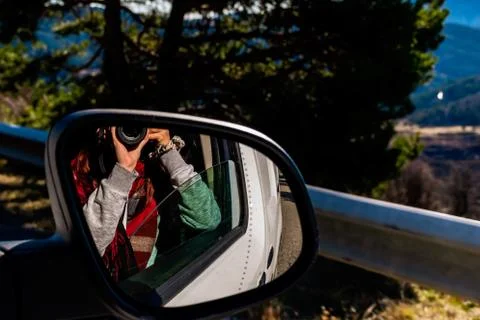 A close-up shot of the reflection of an unrecognizable young Caucasian redhea Stock Photos