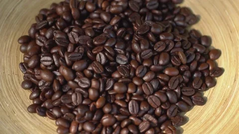 Close-Up Shot of Roasted Coffee Beans Falling off From Hands Stock Footage 137864741