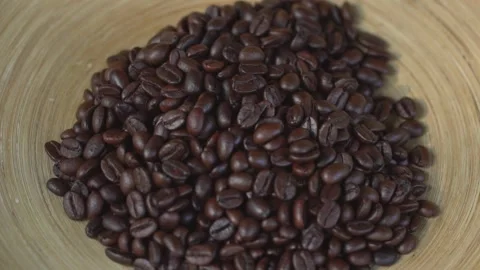 Close-Up Shot of Roasted Coffee Beans Falling off From Hands Stock Footage 137984894