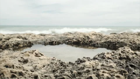 Close shot of rocks on the seashore Stock Footage 138784123