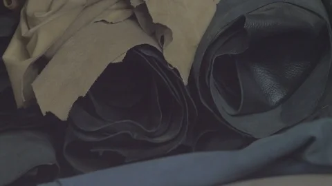 Close up shot of a roll of leather raw materials with different color Stock Footage 107976761