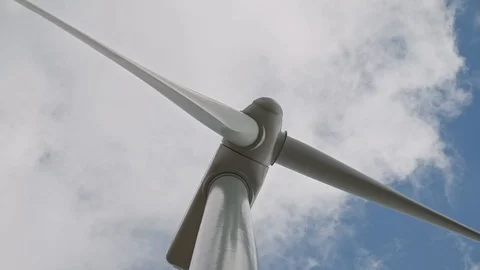 Close up shot of rotating windmill. Clouds are flying the sky. Real time shot. 스톡 동영상 105876238