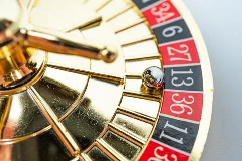 A close-up shot of a roulette wheel, showcasing its numbered compartments a.. Stock Photos