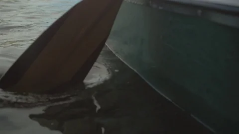 Close up shot of a rowing paddle on a drifting boat Stock Footage 77983096
