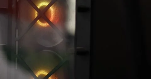Close-up shot of a running computer CPU fan with a mirror reflection showing a Stock Footage 328744389