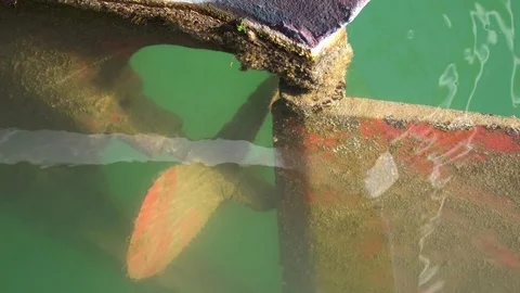Close up shot of a rusty motorboat's engine in marina Stock Footage 109663936
