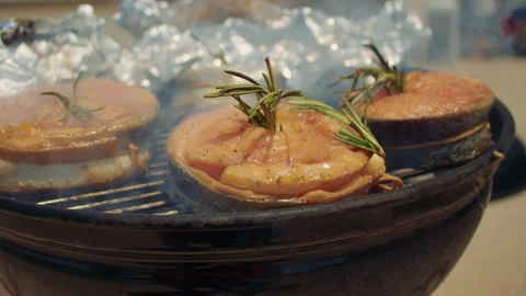 Close-up shot of salmon steaks on roasting grate of a barbecue brazier. BBQ Stock Footage 285467703
