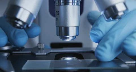 Close-up shot of sample slide and microscope. 스톡 동영상 120728229