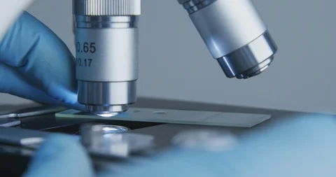 Close-up shot of sample slide and microscope. Vídeo Stock 120729793