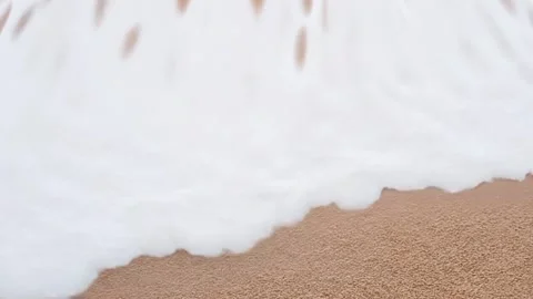 Close up shot of sandy beach and ocean with waves Stock Footage 280444419