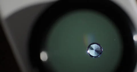 Close-up shot of sapphire gemstone under the microscope in the gemmological Stock Footage 247897657