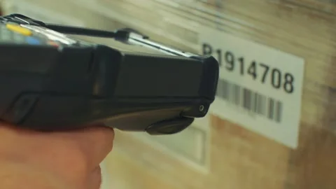 Close-up shot of scanning the barcode on the package with a barcode Stock Footage 137386262