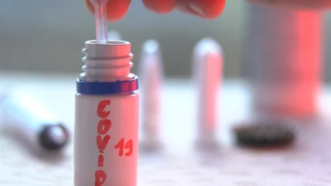 Close up shot of the scientist studies examining of test sample under the Video stock 128976673