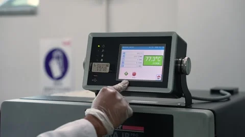 Close Up Shot Of A Scientist Using A Touch Screen On A Laboratory Machine While Stock Footage 334205739