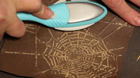 A close shot of  scraping spider web on  scrapbook Stock Footage 115213262