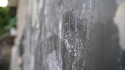 A close up shot of a scratched textured wall with black and white areas Vídeos de archivo 123675847