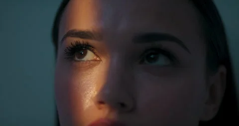 Close up shot selective focus of beautiful woman's dark brown eyes looking Stock Footage 260519688