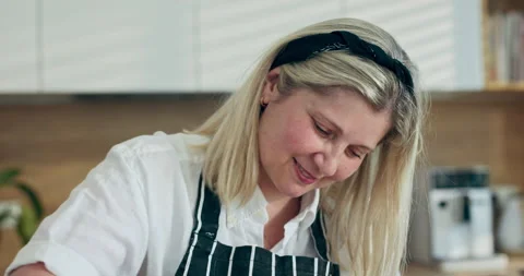 Close up shot selective focus on kneading process on wooden surface. Happy Stock Footage 218646497