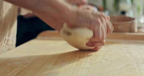 Close up shot selective focus on wooden surface man's hands kneading homemade 스톡 동영상 218633865