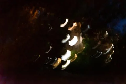 Close up shot of Several different colored lines moving in the dark Stock Photos