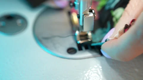 Close up shot of sewing process in workshop, seamstress woman's hands stitching Stock Footage 246965580