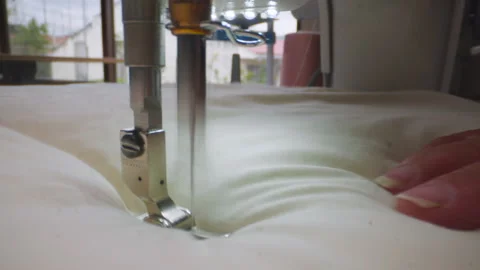 Close-up shot, sewing thick fabric with a sewing machine Stock Footage 344325407