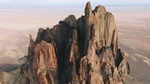 Close-up shot of sharp rocky peaks of mountainous range with blue skyline behind 스톡 동영상 170284092