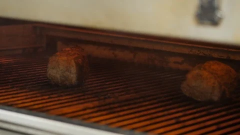 Close up shot shot of two cuts of meat roasting on the grill Stock Footage 107342789